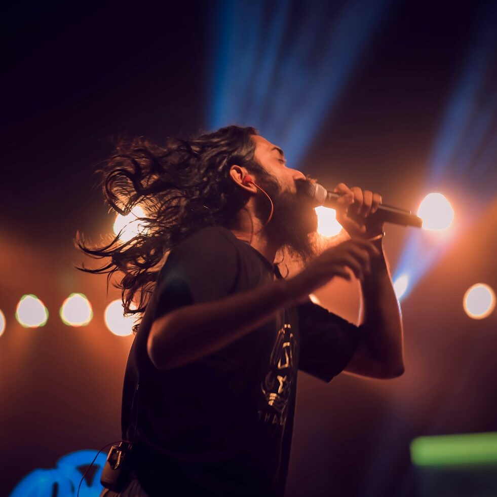 man holding microphone on stage