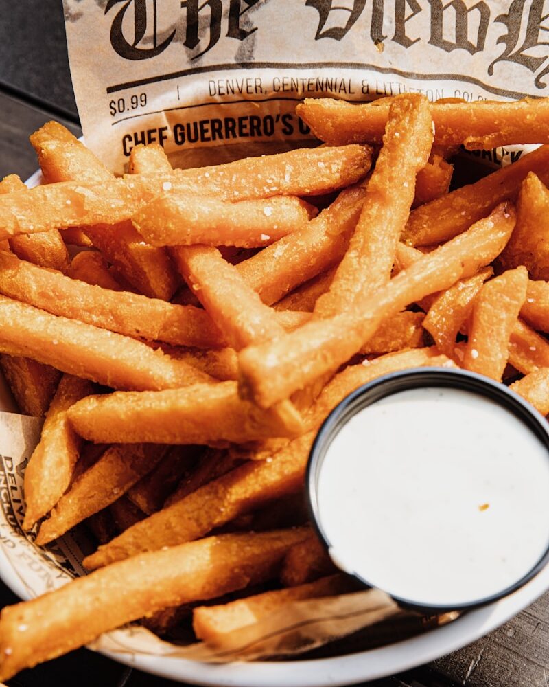 fried fries on white paper